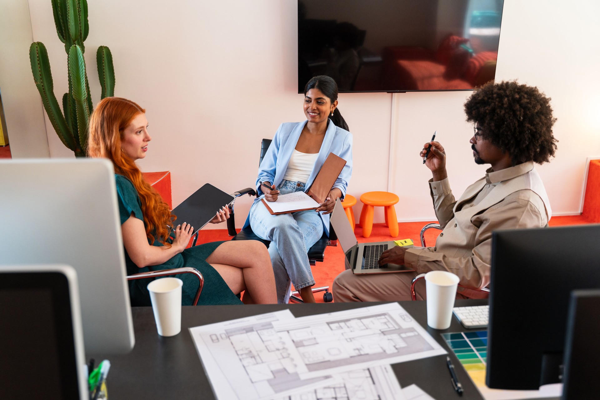 Multiethnic small group of businesspeople meeting in a coworking company office